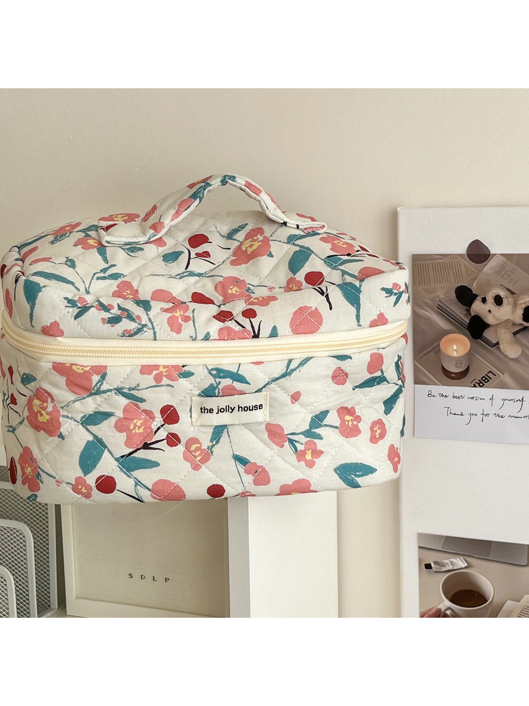 Cosbai Bloom Print Cosmetic Bag displayed on a flat surface highlighting the bloom print