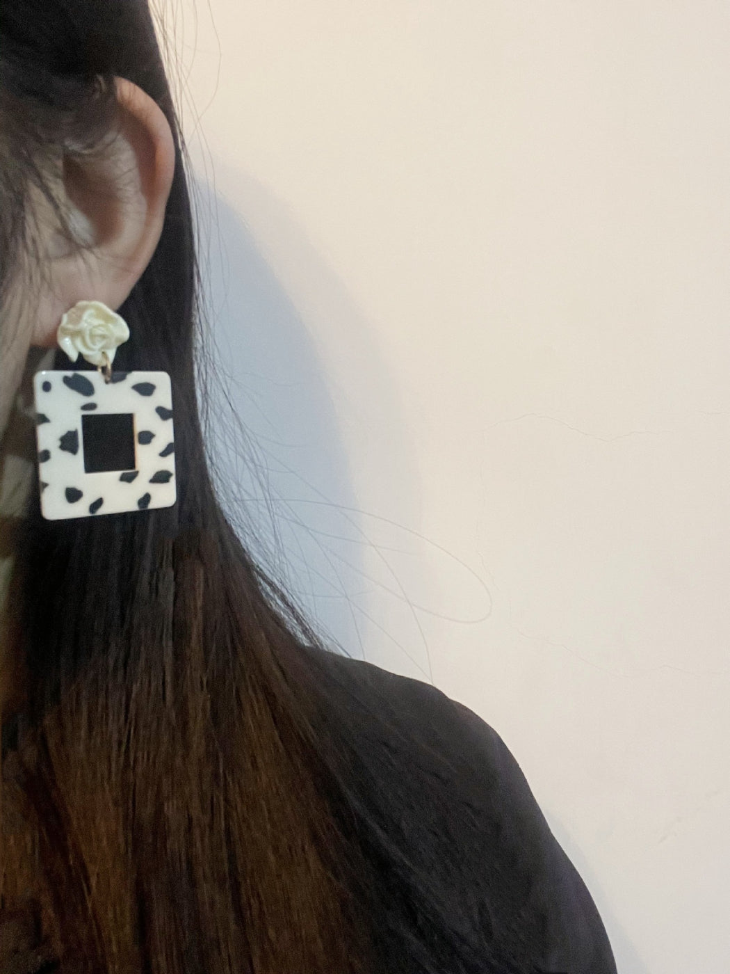 Earwish Cow Print Rose Earrings displayed on a white background highlighting the unique pattern and rose