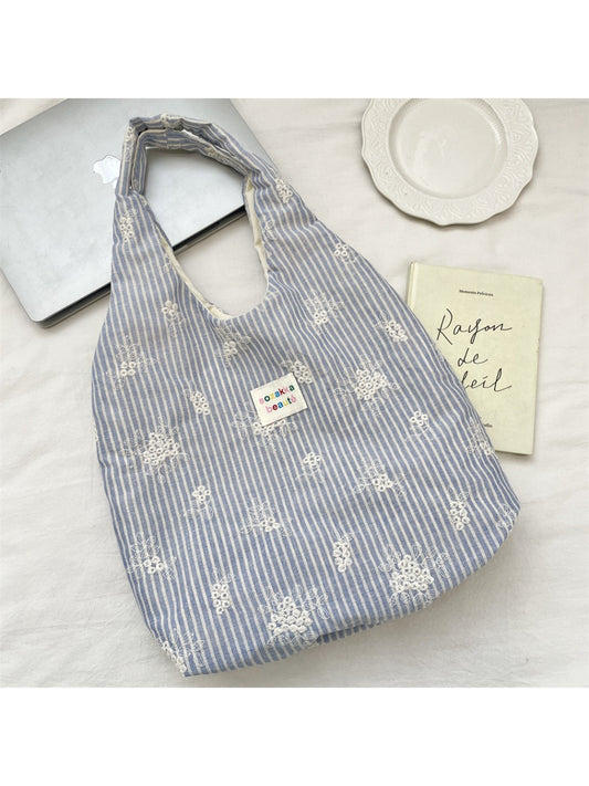 Side view of Cosbai Soft Stripe Everyday Tote Bag showing striped pattern and handles