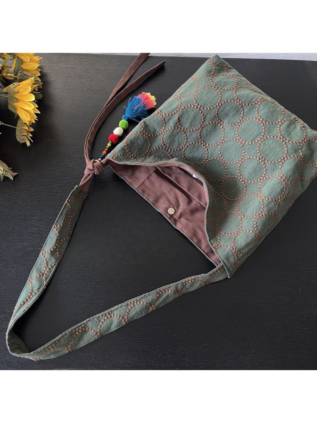 Cosbai textured circle pattern tote bag placed on wooden surface with lighting