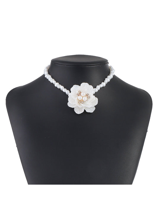 White beaded flower necklace displayed flat showing full length and detailed beadwork