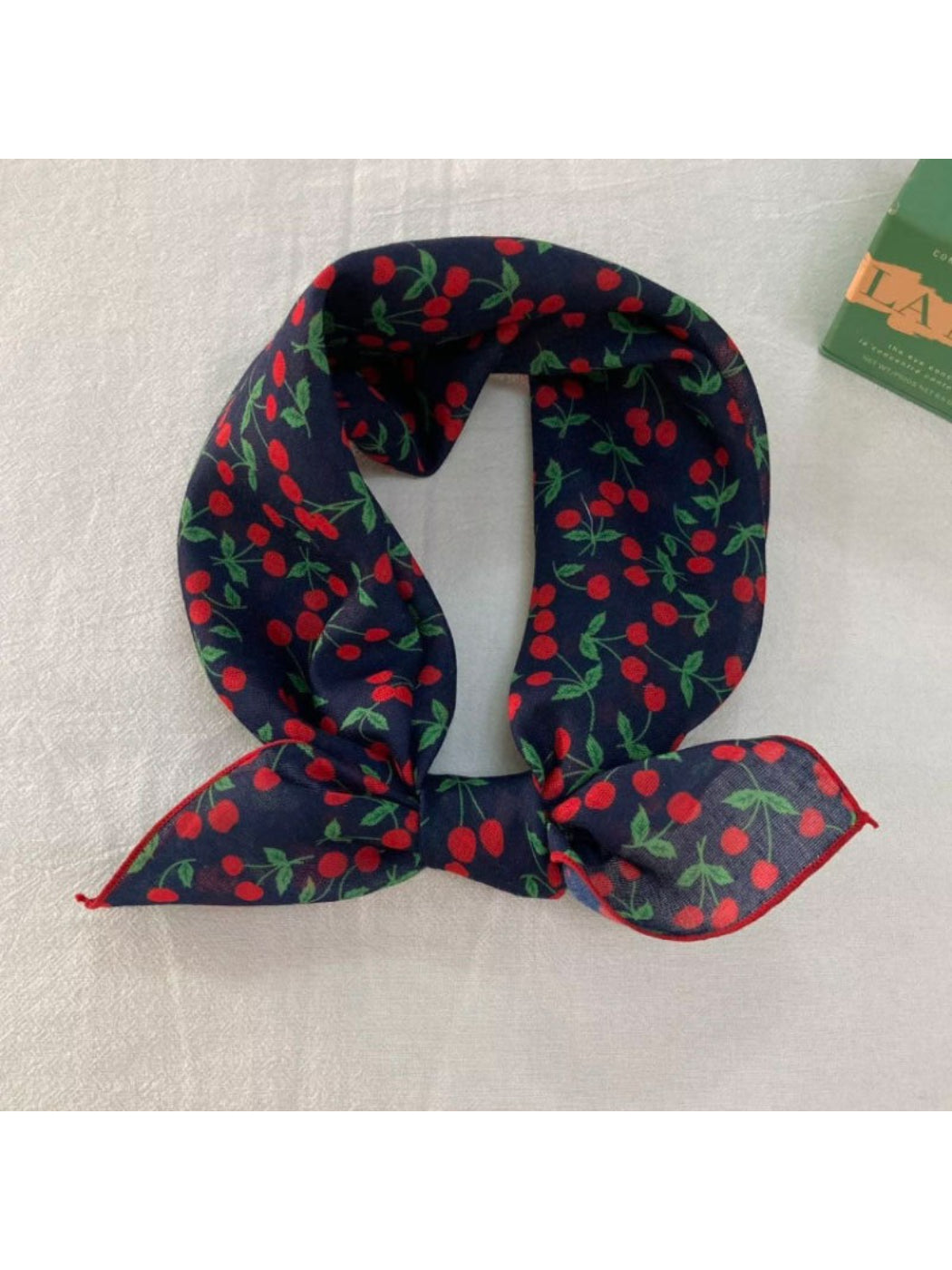 Scarf styled as a headwrap featuring the soft garden floral print