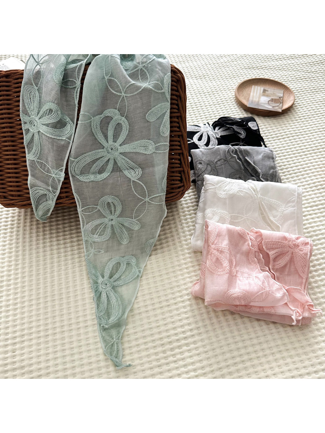 Soft sheer embroidered triangle scarf styled as a headscarf on model
