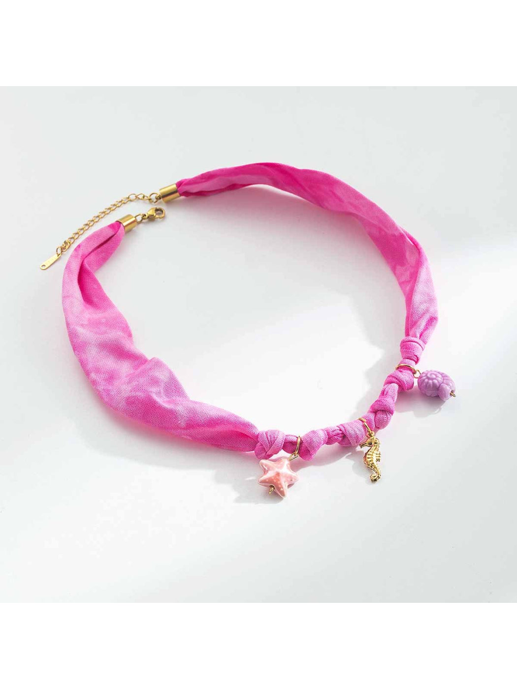 Neckit Summer Charm fabric necklace styled with matching summer accessories