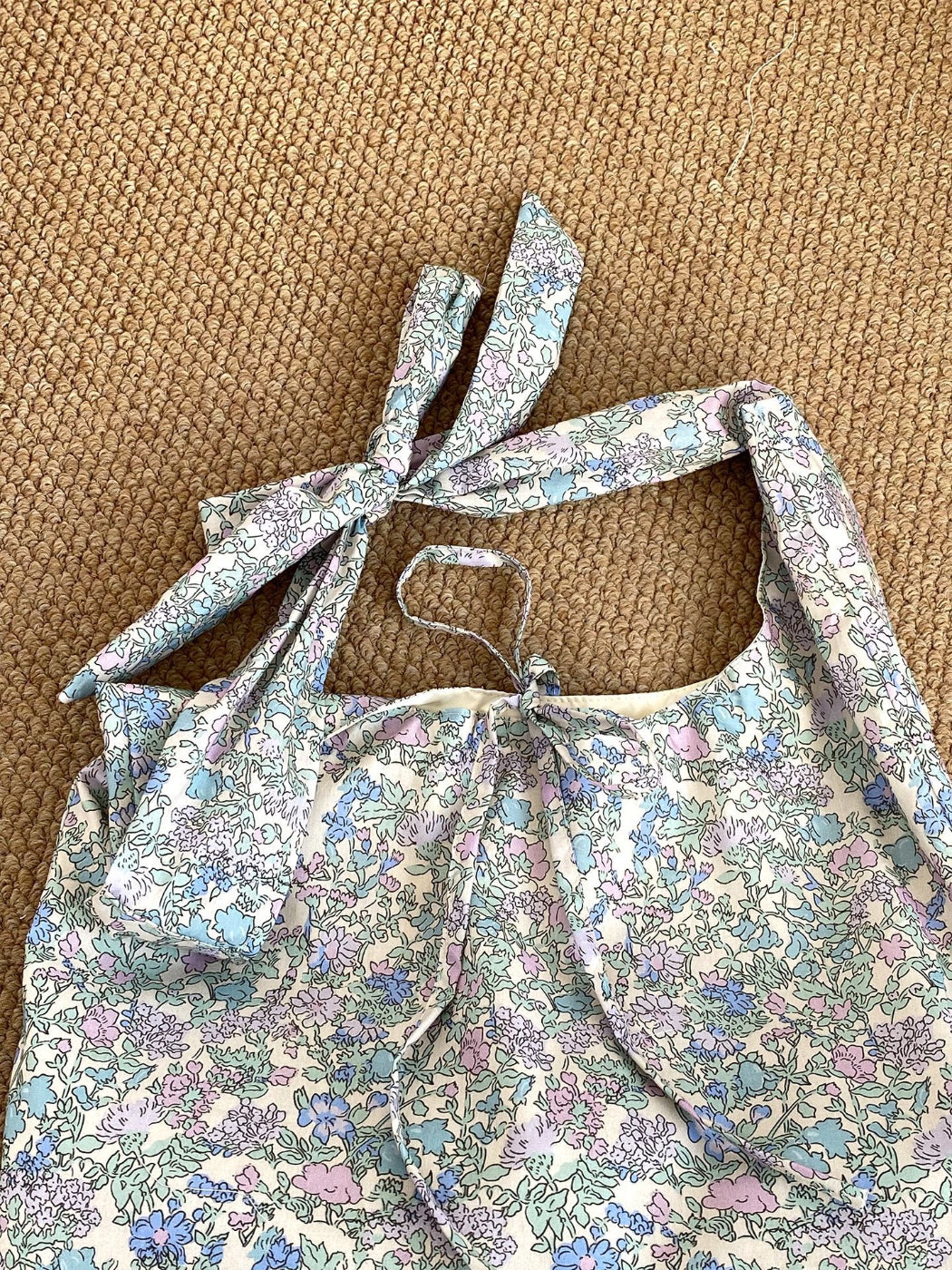 Cosbai boho tie strap sling tote bag styled with casual summer outfit