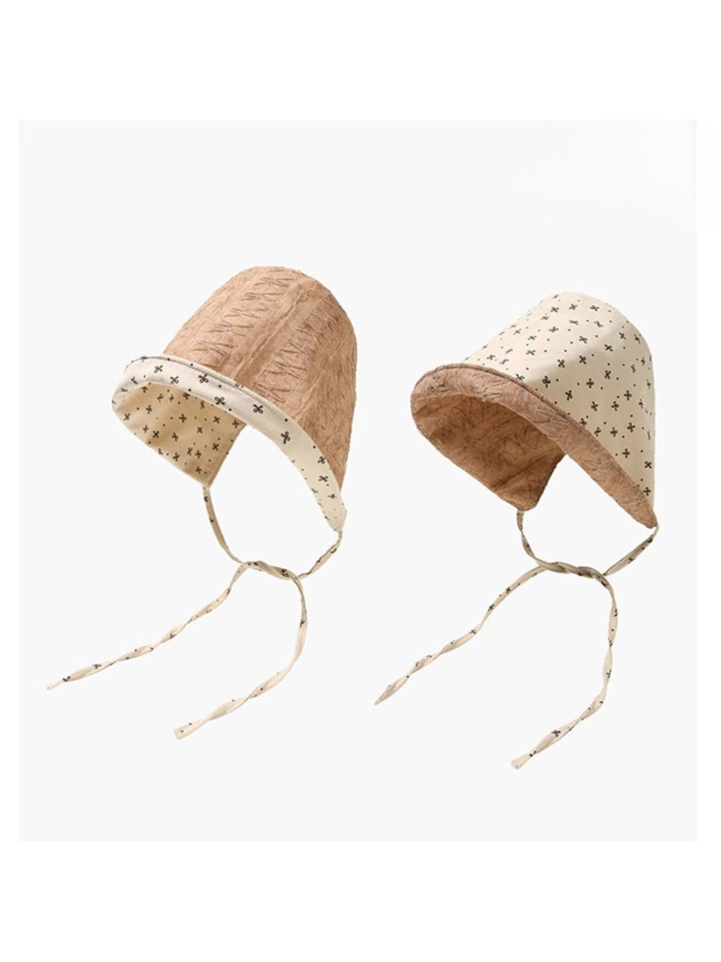 Model wearing Haila reversible bonnet showing solid pink side with floral pattern inside