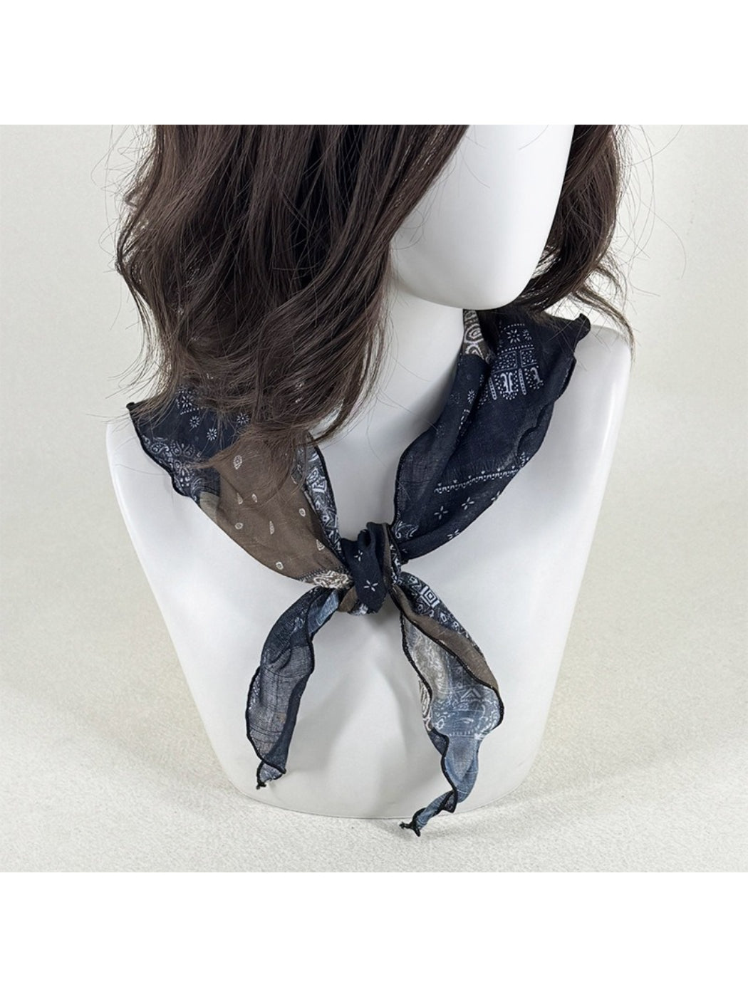 Scarvii sheer triangle scarf laid flat highlighting black and white bandana design