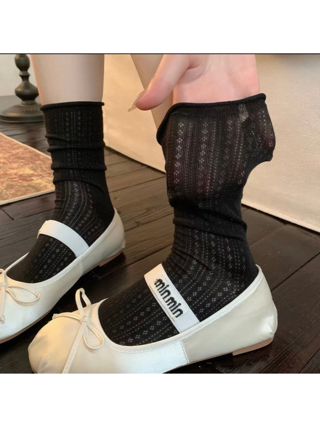 Rufia ribbed mid-calf socks displayed on mannequin foot