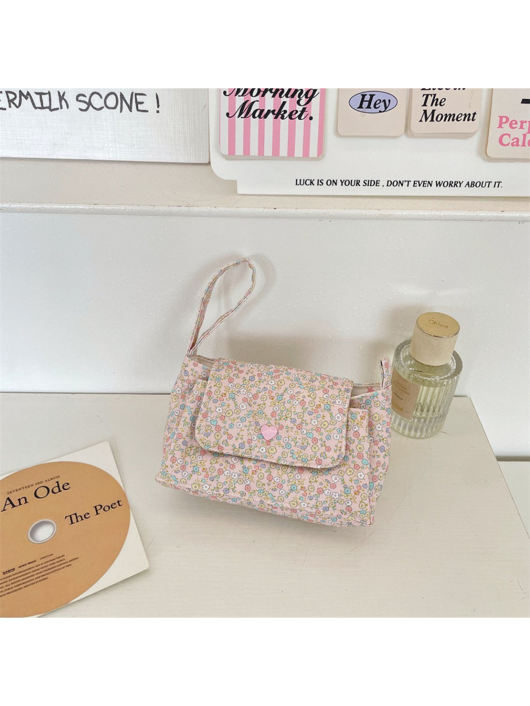 Cosbai Mini Handle Bag placed on table highlighting floral pattern and compact design