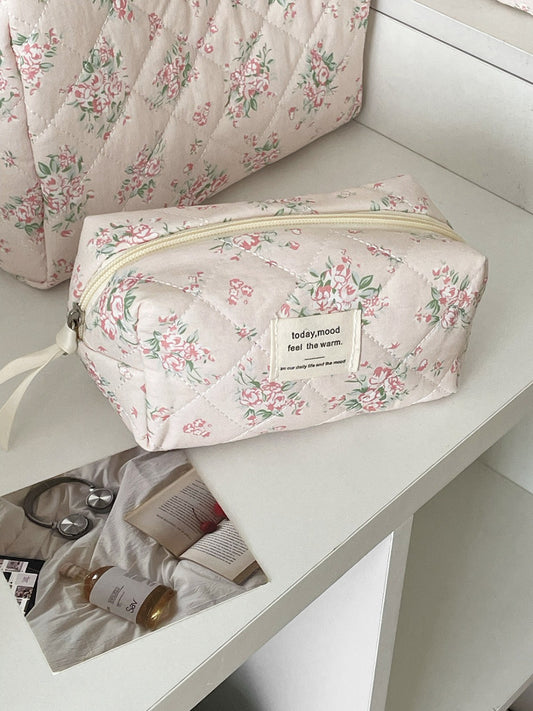Inside view of Cosbai floral quilted makeup bag showing spacious and lining