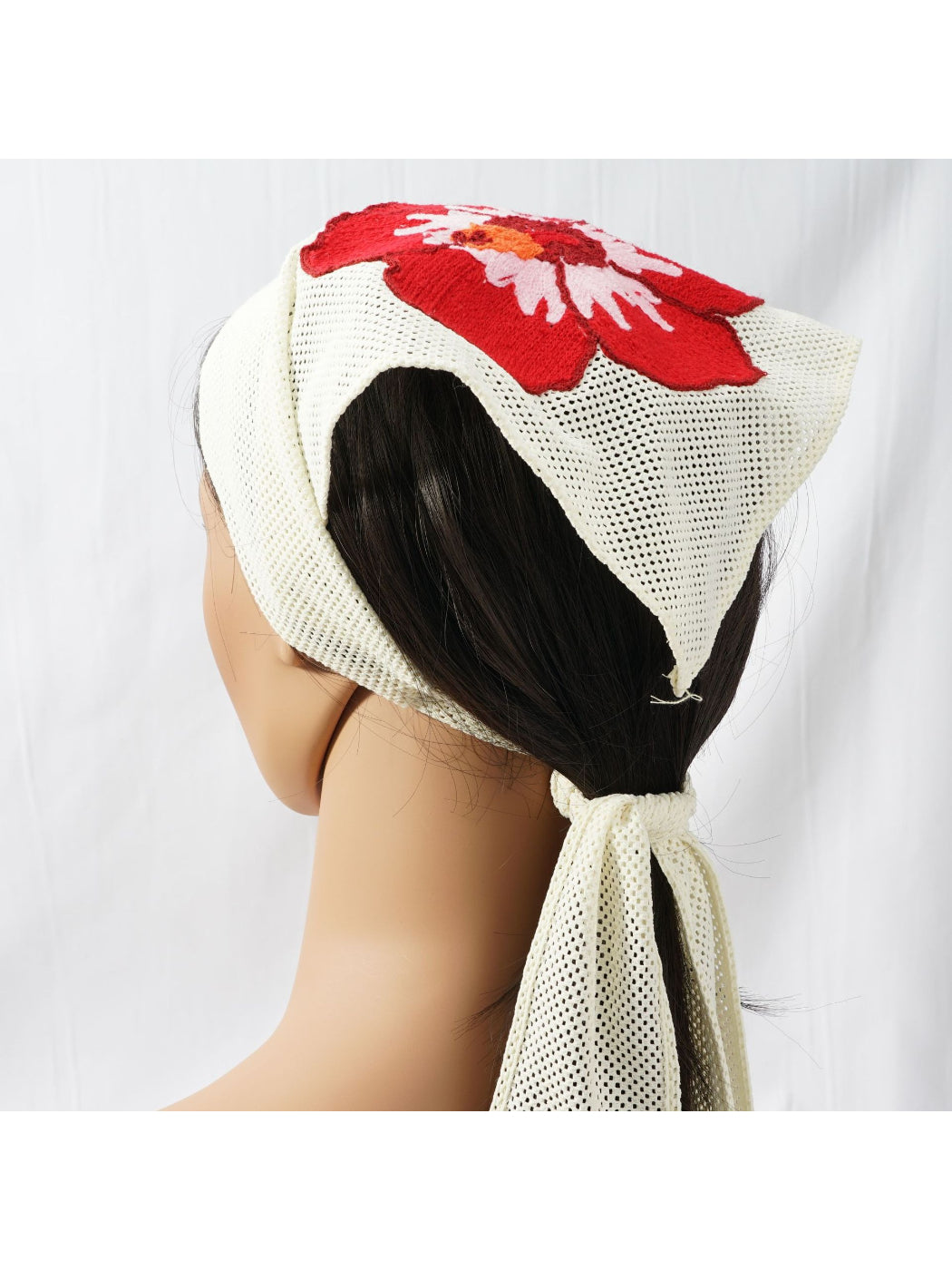 Scarvii bandana scarf folded with detailed floral embroidery in vibrant colors