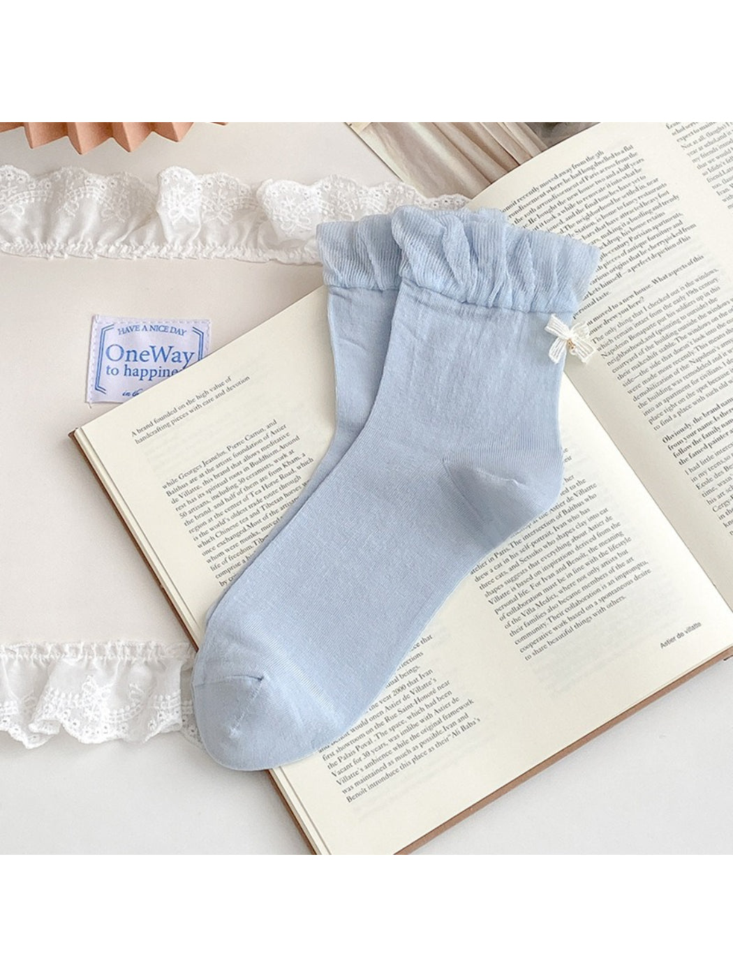 Folded Rufia ruched ankle socks showing bow charm and soft fabric