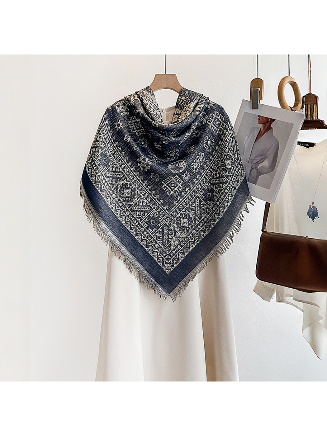 Navy geometric square scarf styled in a pointed front drape