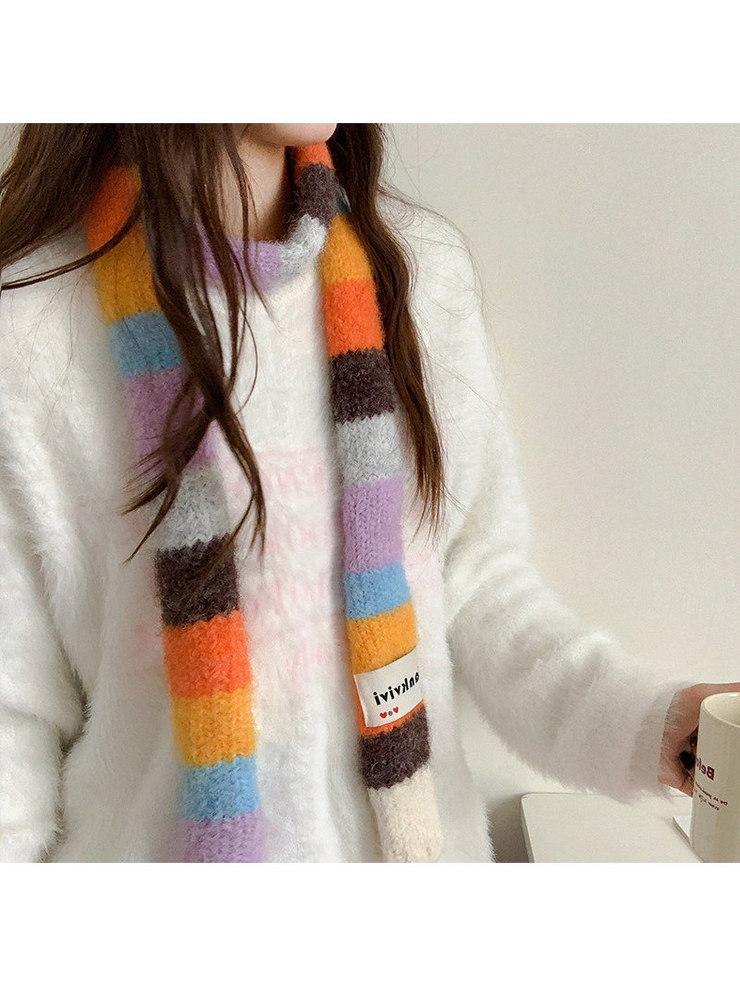 Orange, brown, lavender and blue fuzzy color-block scarf worn in a loose front drape