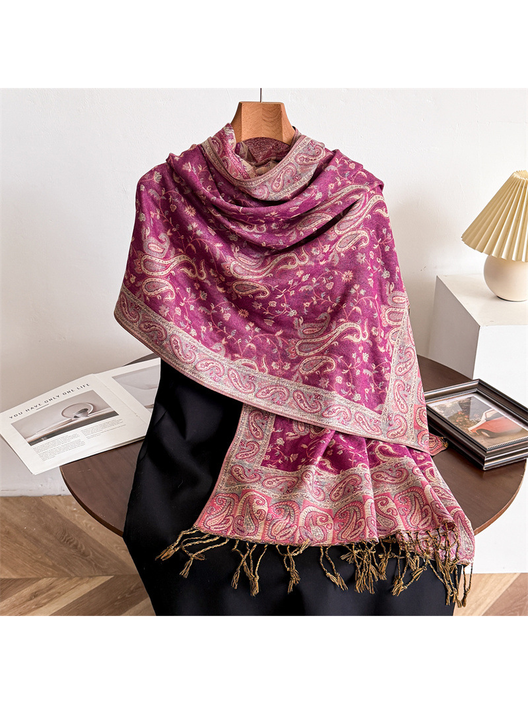 Fuchsia paisley scarf draped on a display form with fringed ends