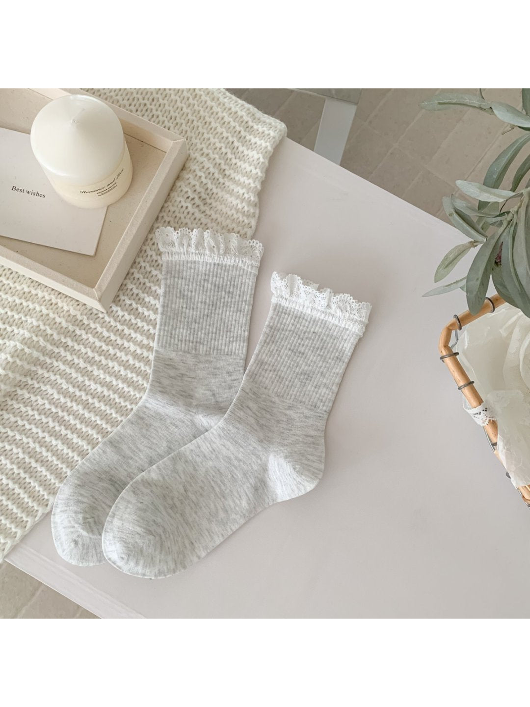 Light heather gray crew socks with white lace-trim cuffs, full pair view