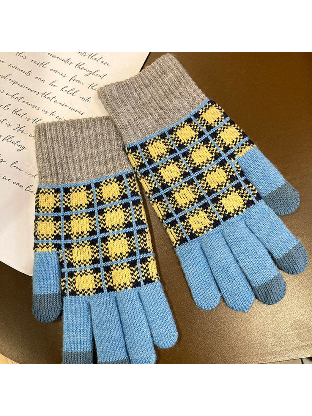 Light blue gloves with a navy and yellow checked pattern