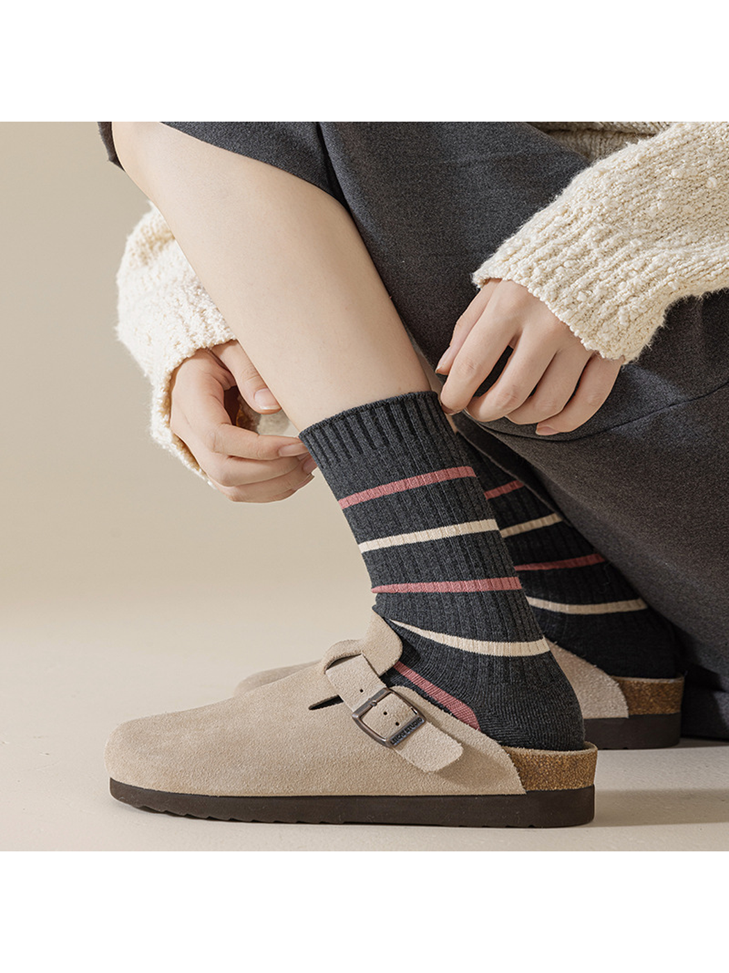 Dark gray crew socks with fine pink and ivory stripes worn with clogs