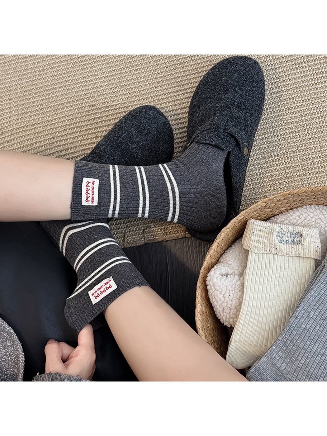 Dark gray striped ribbed socks worn with charcoal slippers
