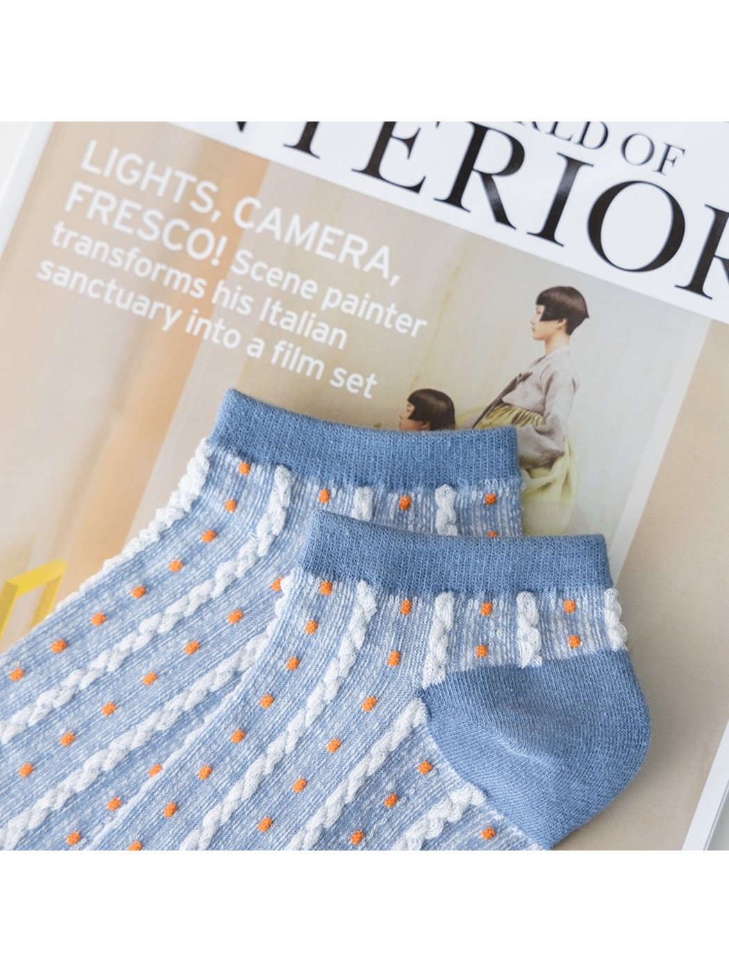 Close-up of the light blue sock cuffs, heels and dotted stripe texture