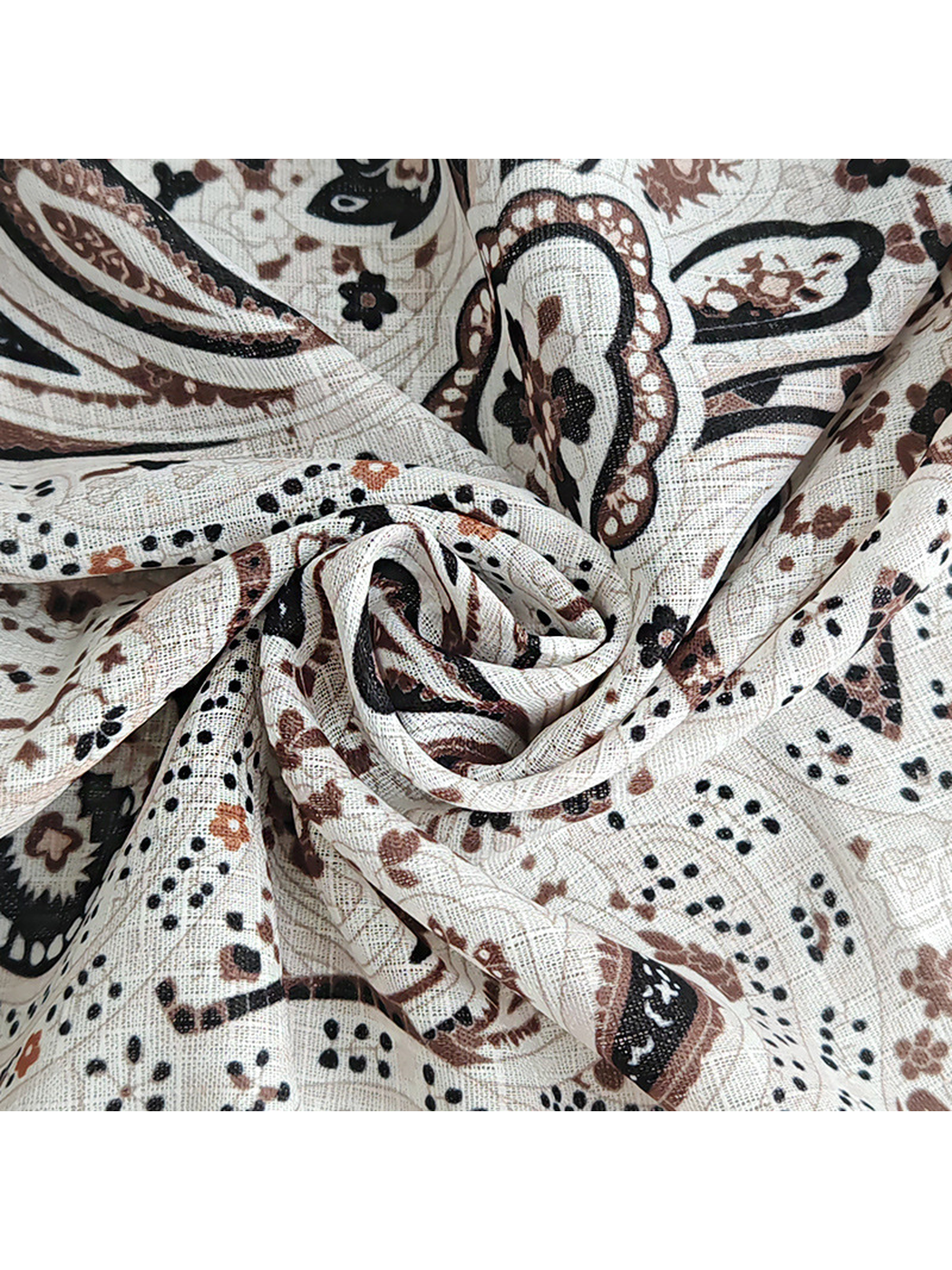 Close-up of the scarf's fine crosshatched texture and paisley print