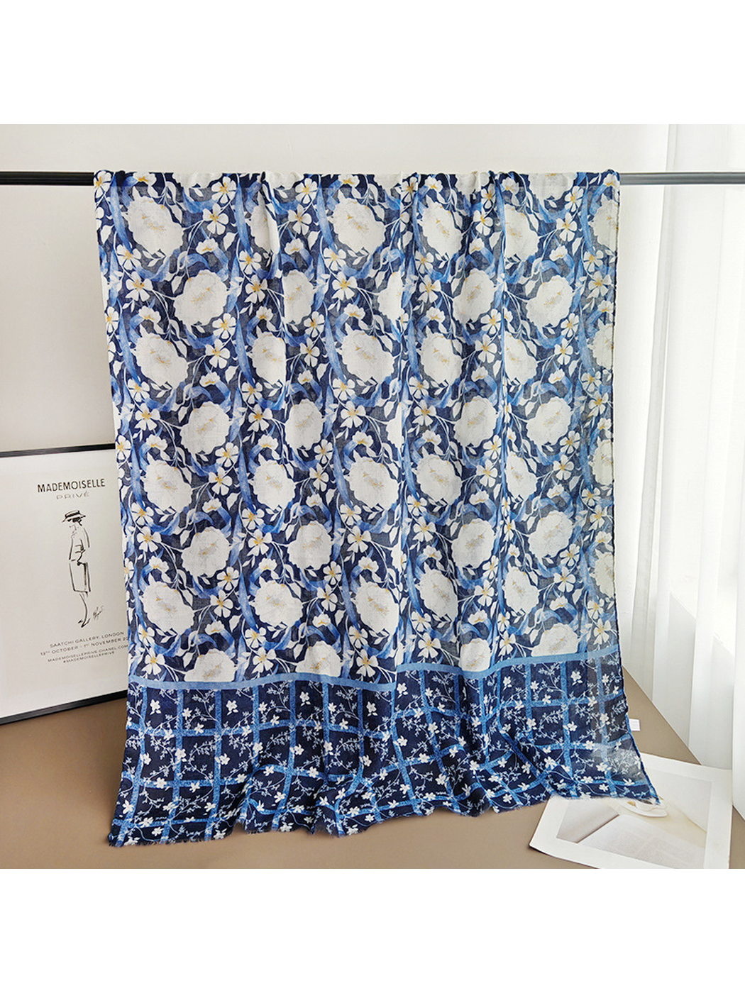 Navy floral rectangular scarf displayed fully open with its contrasting border