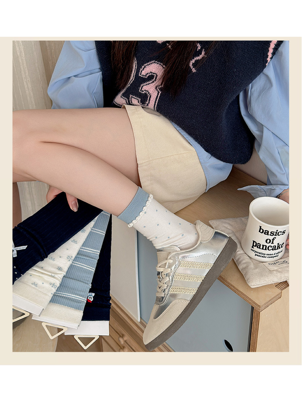 Ivory Polka Dot crew socks worn with silver-tone sneakers