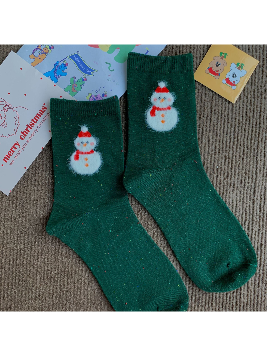 Snowman dark green crew socks with a fuzzy white motif