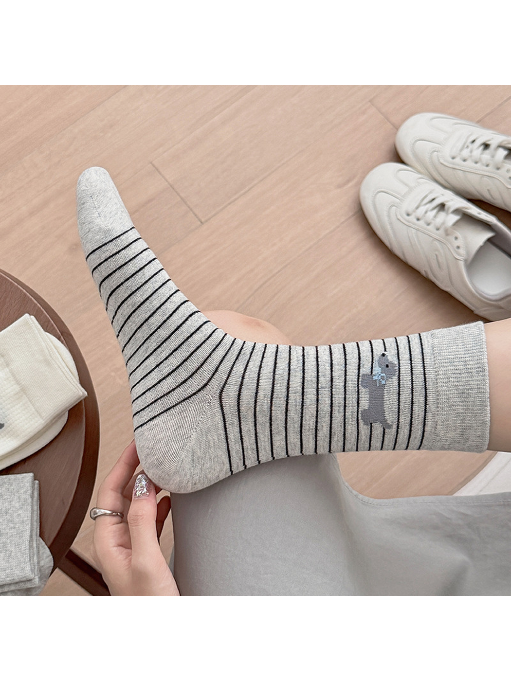 Close-up of a Gray Stripes crew sock with a dog motif