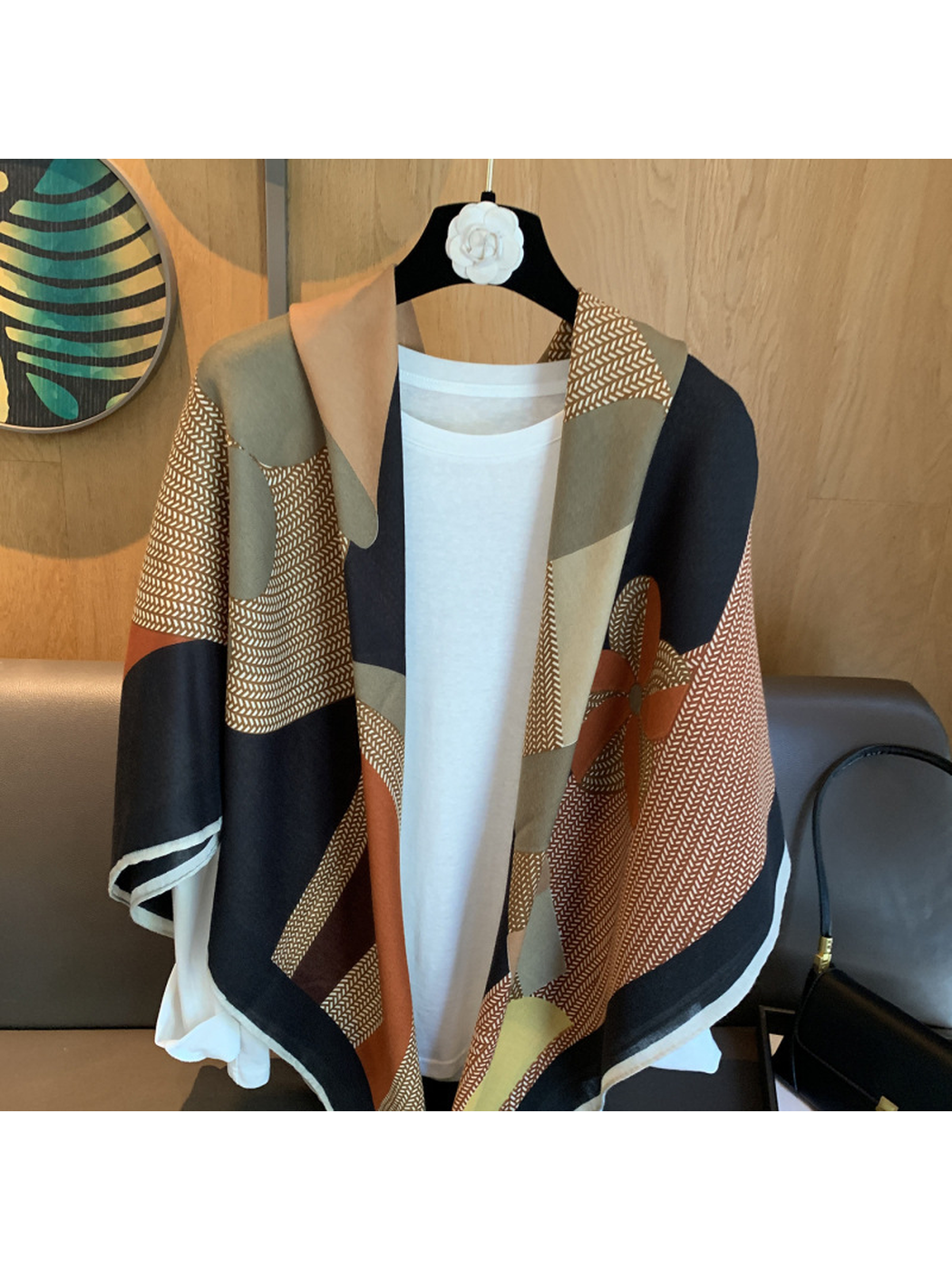 Close-up of the multicolor scarf with fine chevron-like lines and abstract motifs