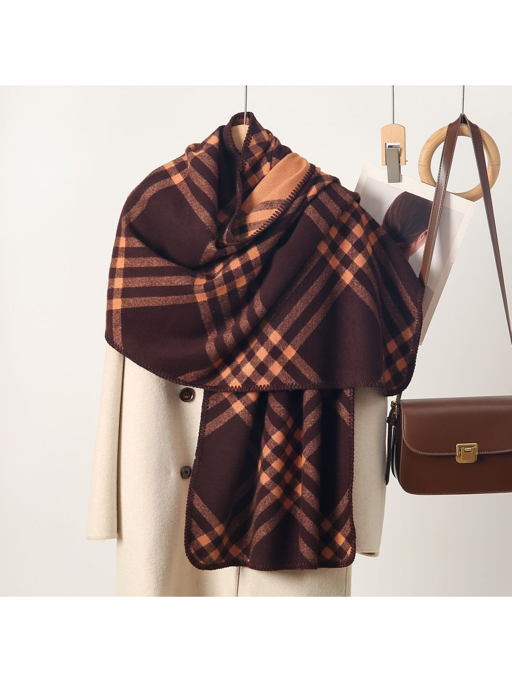 Brown plaid rectangular scarf with stitched edges, draped display