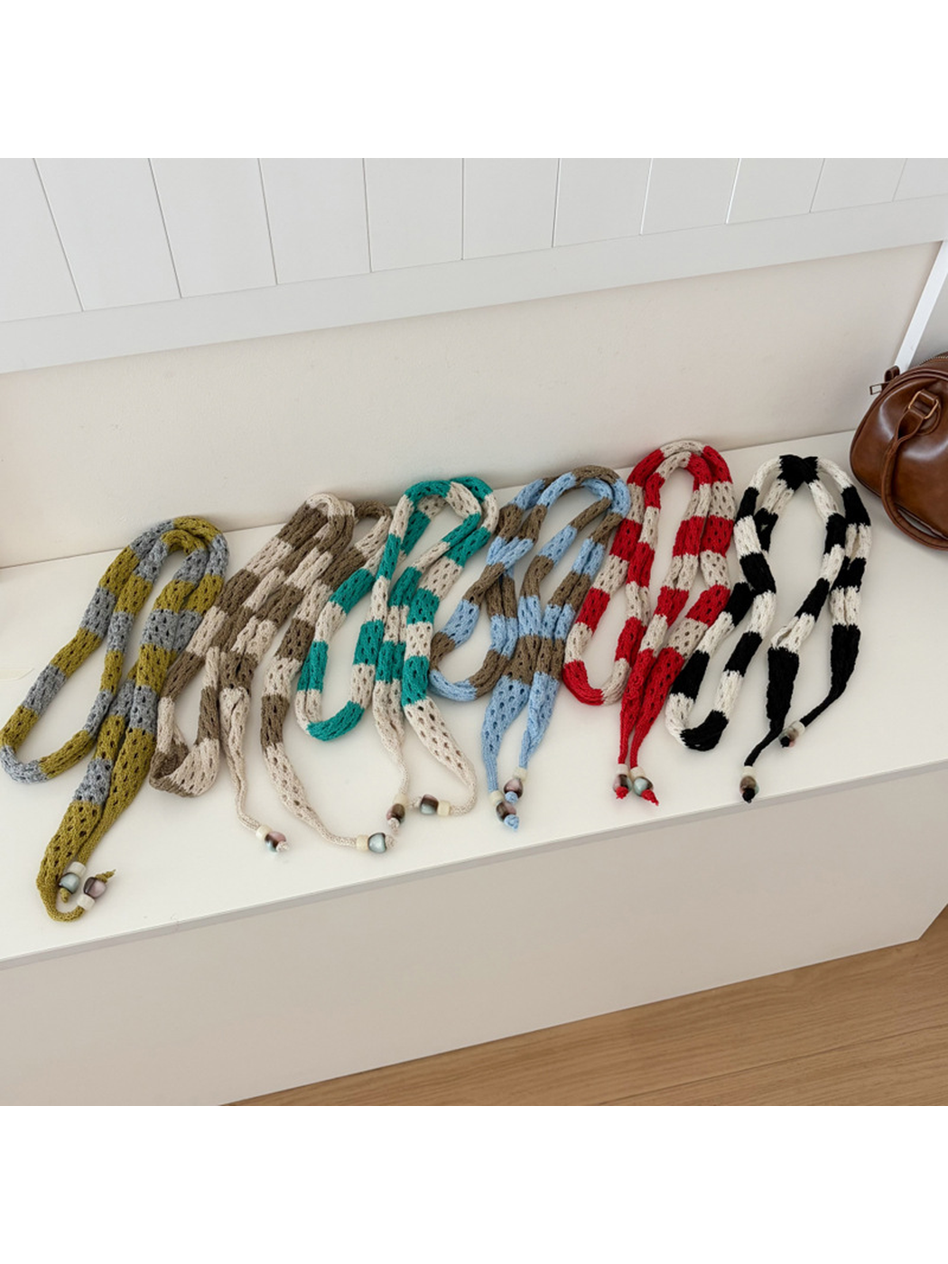 Six striped openwork scarf styles displayed together