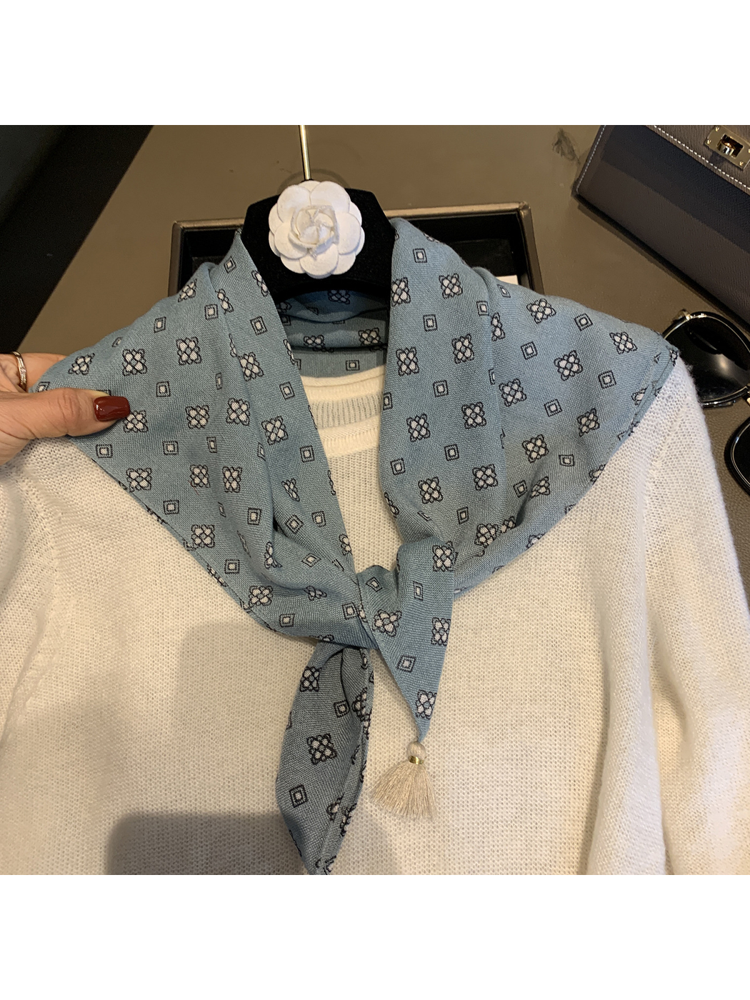 Close-up of the Blue scarf tied in a front knot with tassel ends