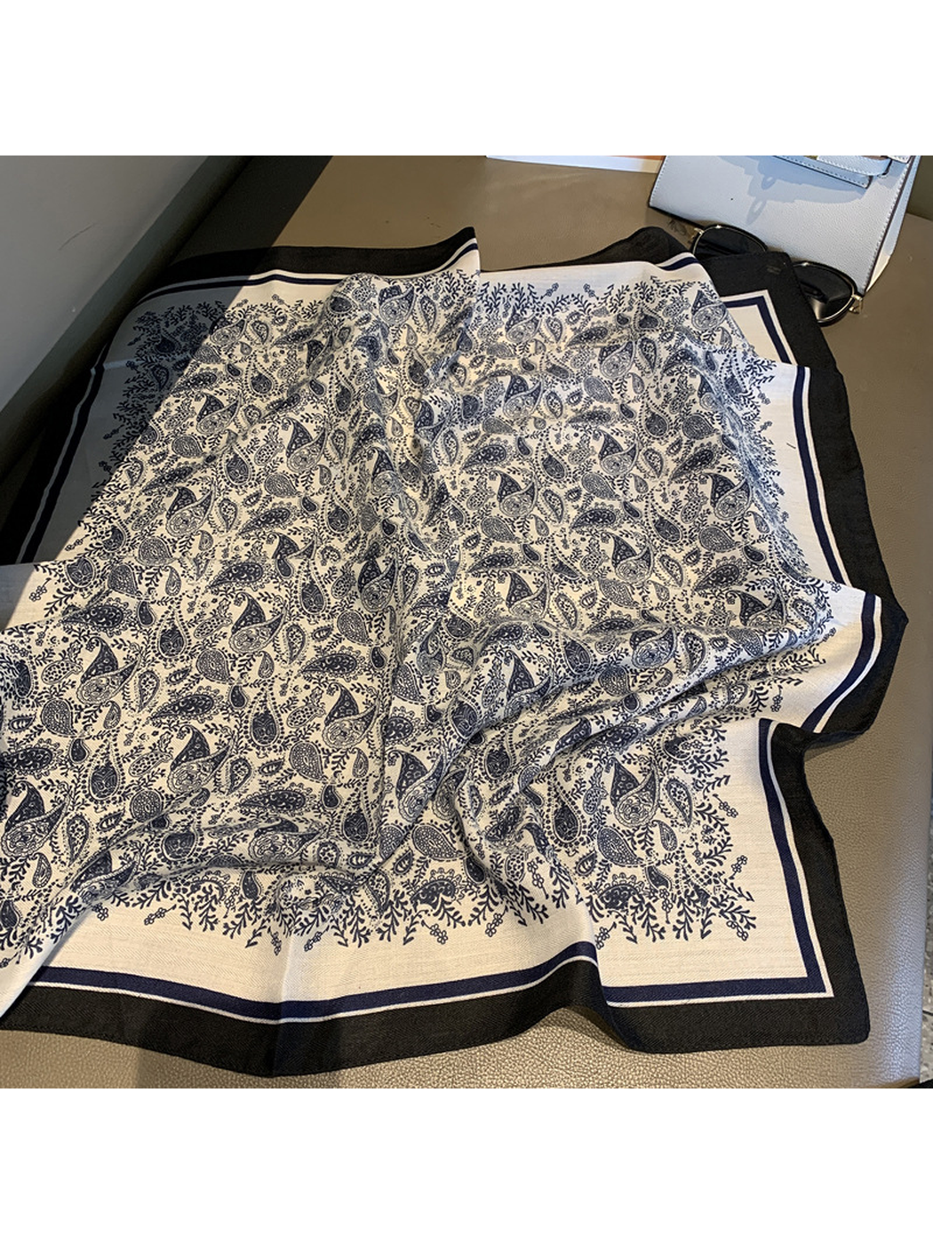 Navy and cream paisley square scarf spread to show the botanical border