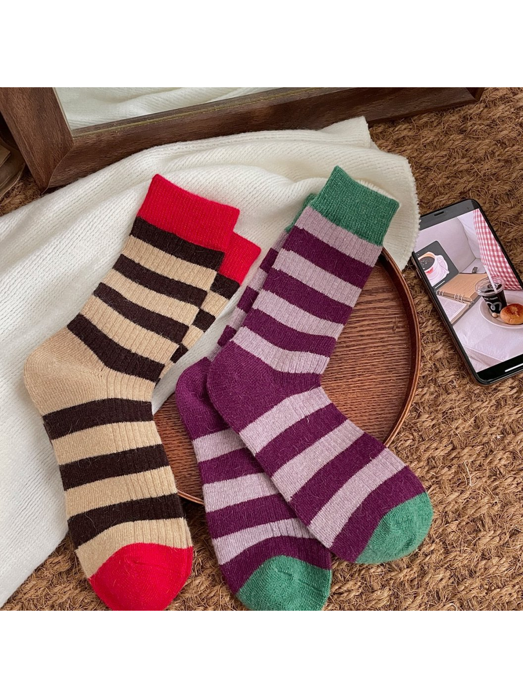 Brown and Purple striped crew socks arranged on a textured surface