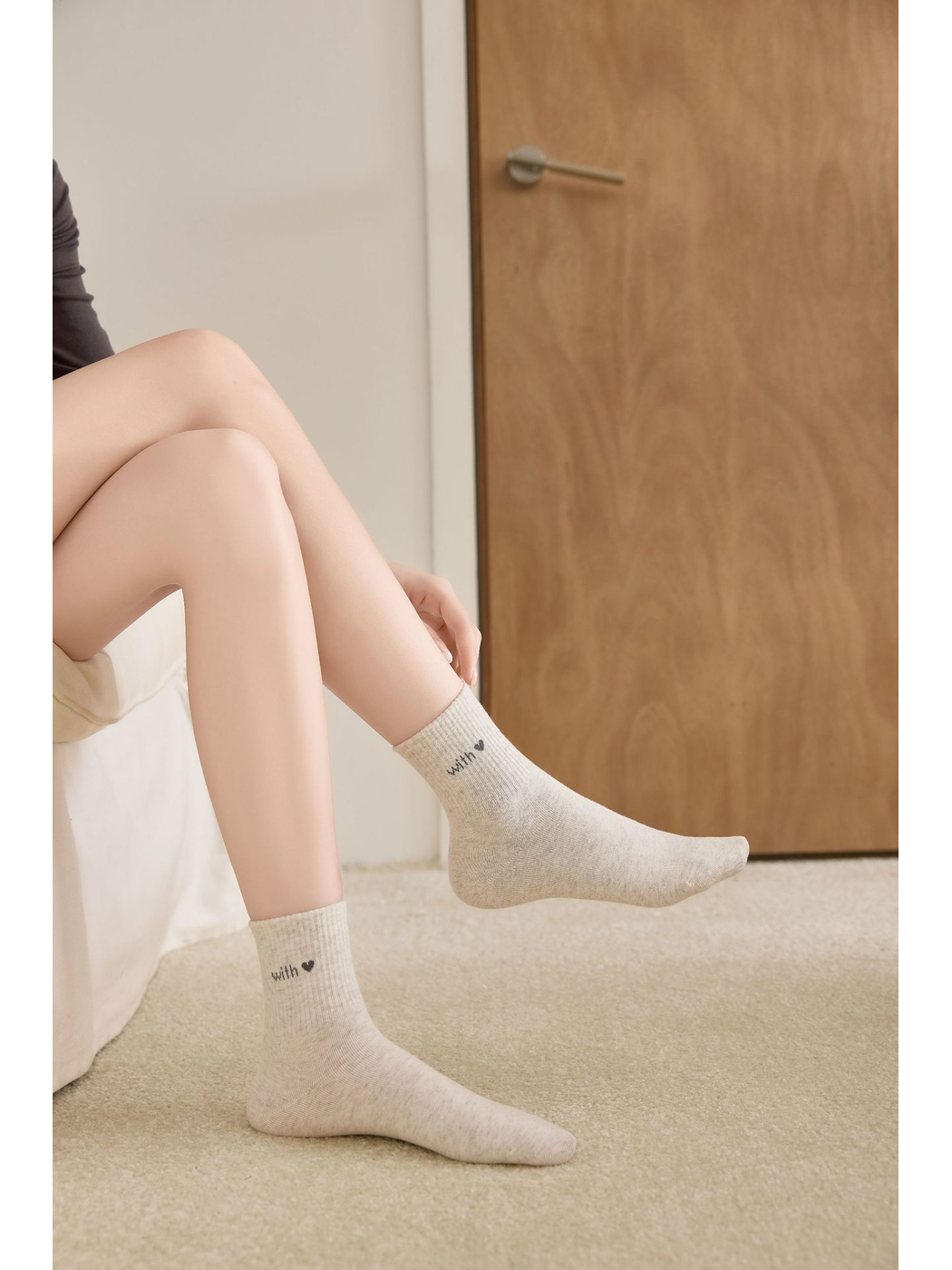 Beige ankle socks worn without shoes, side view