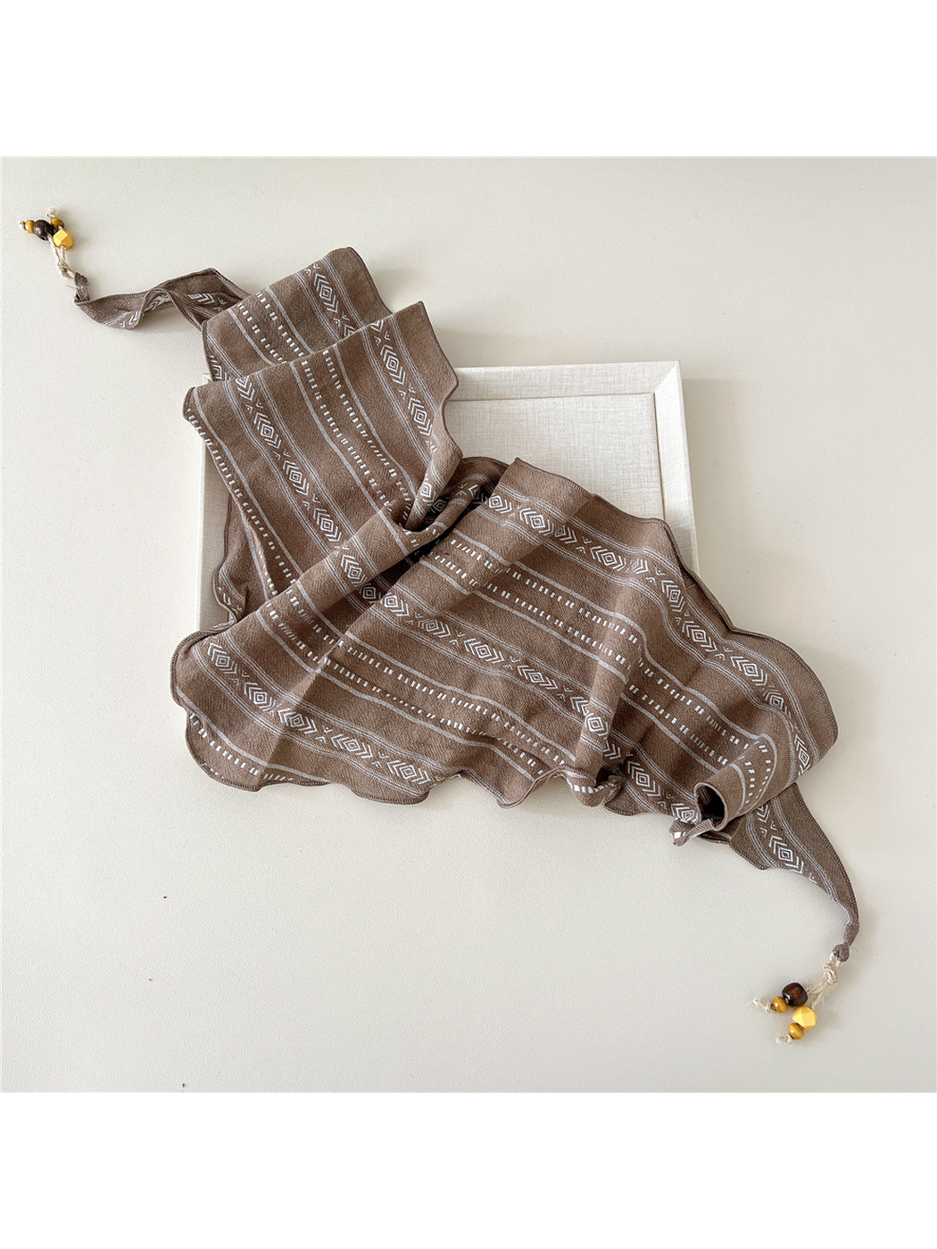 Camel geometric triangle scarf spread to show its full shape