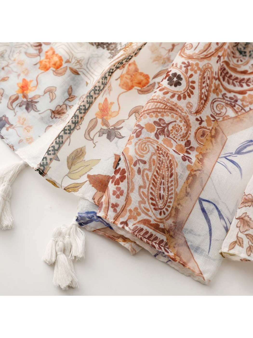 Close-up of the scarf's stitched edge and knotted white tassels