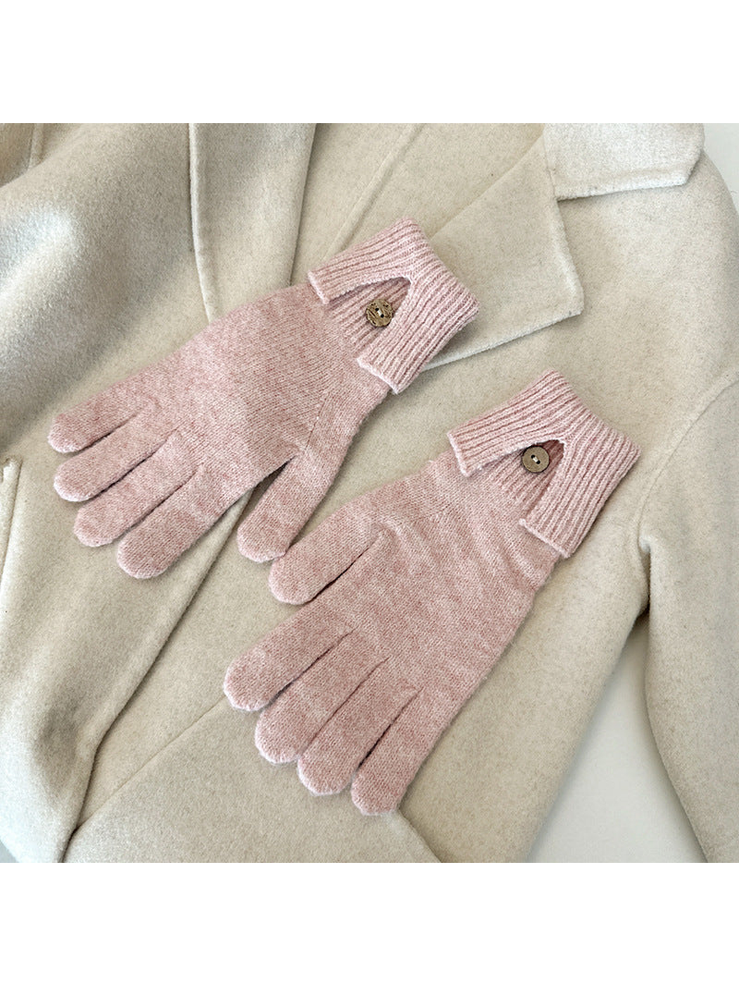 Blush Pink gloves arranged on a cream coat