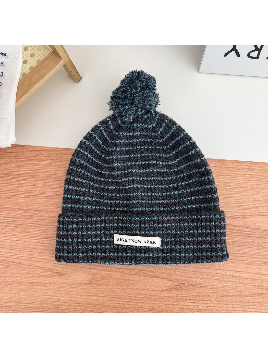 Gray Blue pom-pom beanie with wavy stripes and folded cuff