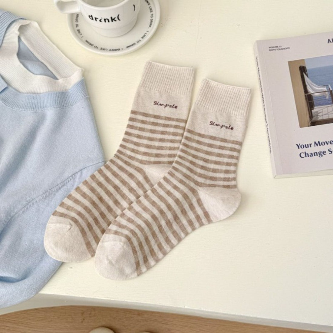 Rufia casual fine stripe crew socks paired with casual shoes on wooden floor
