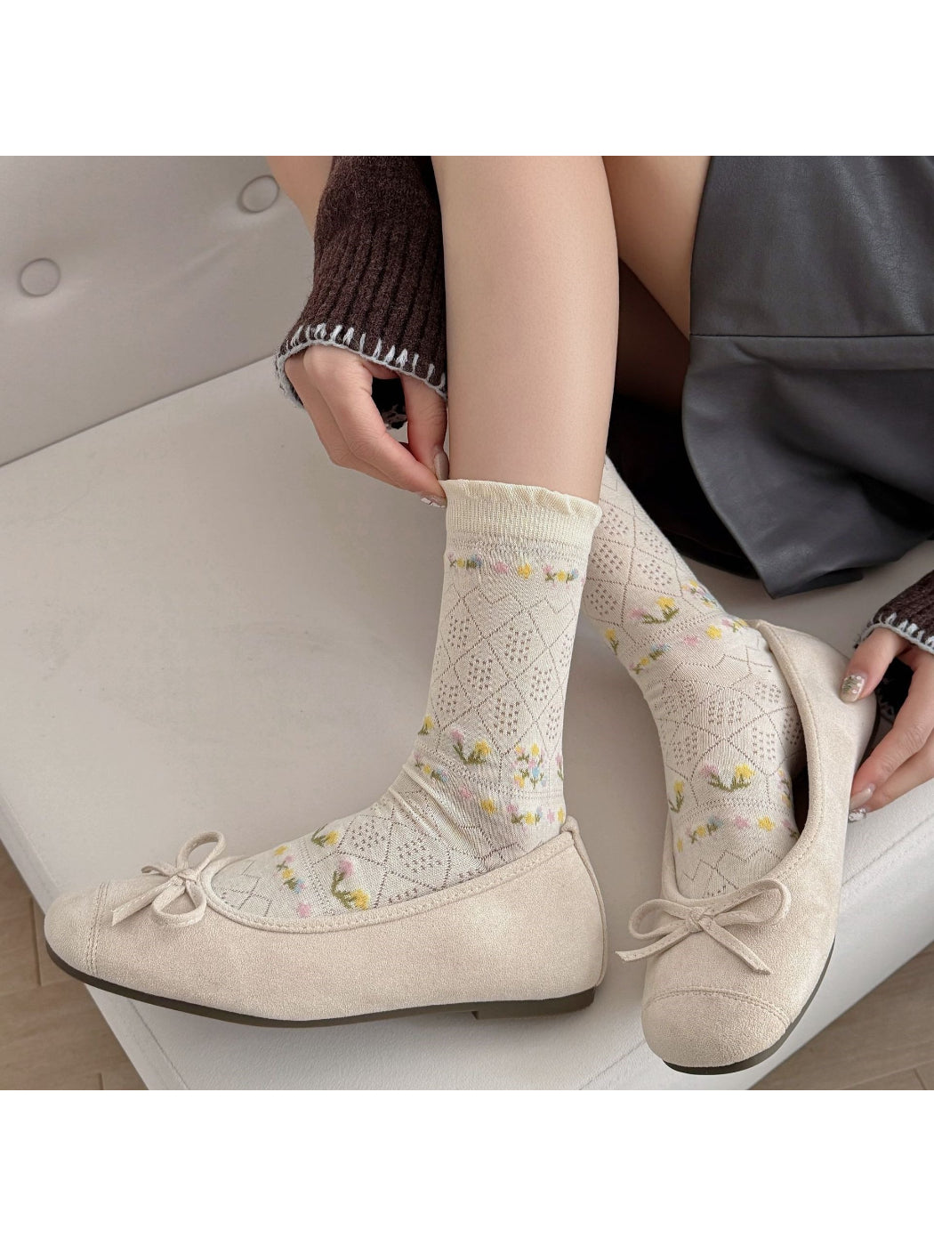 Rufia floral lace ankle socks styled with a summer outfit on a model