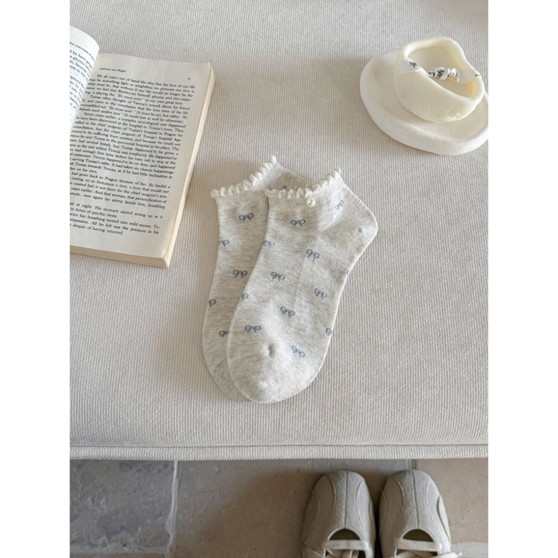 Packaging of Rufia bow motif no show socks with branding and product information