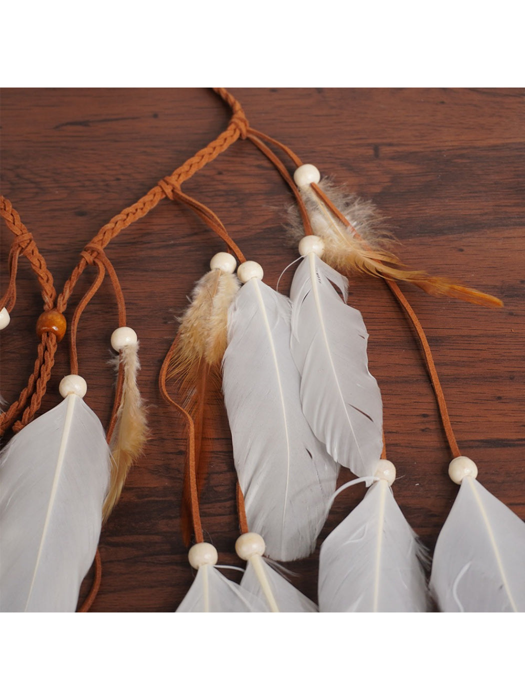 Hairish Boho multi drop feather hair headpiece displayed on a white background
