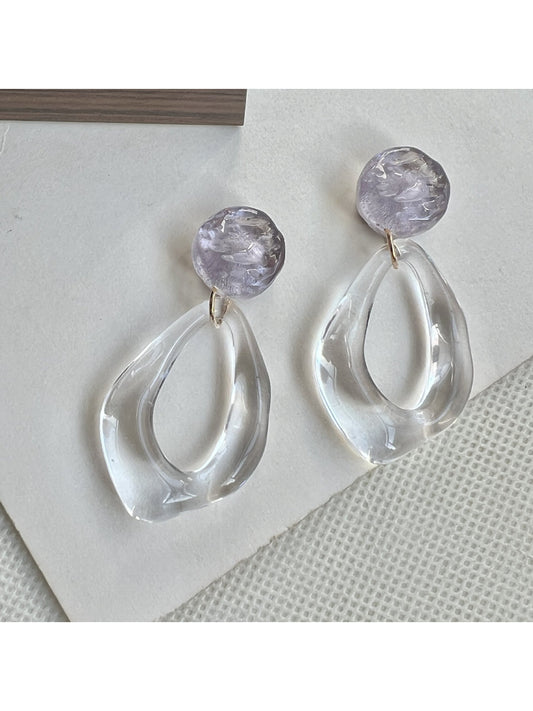 Earwish clear teardrop hoop earrings displayed hanging on a stand