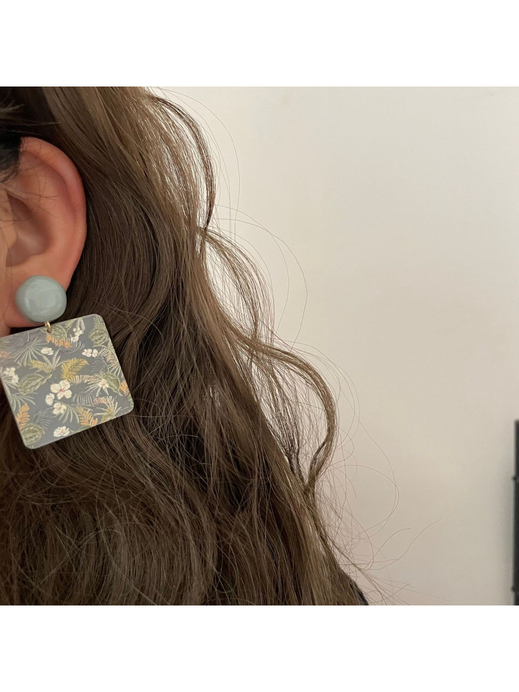 Side view of Earwish Botanical Square Drop Earrings highlighting drop style
