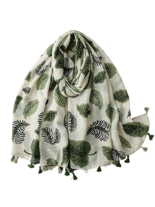Close-up of Scarvii Jungle Leaf Fringe Scarf fabric texture and detailed leaf print