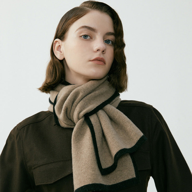 Model wearing Scarvii contrast knitted scarf wrapped around neck