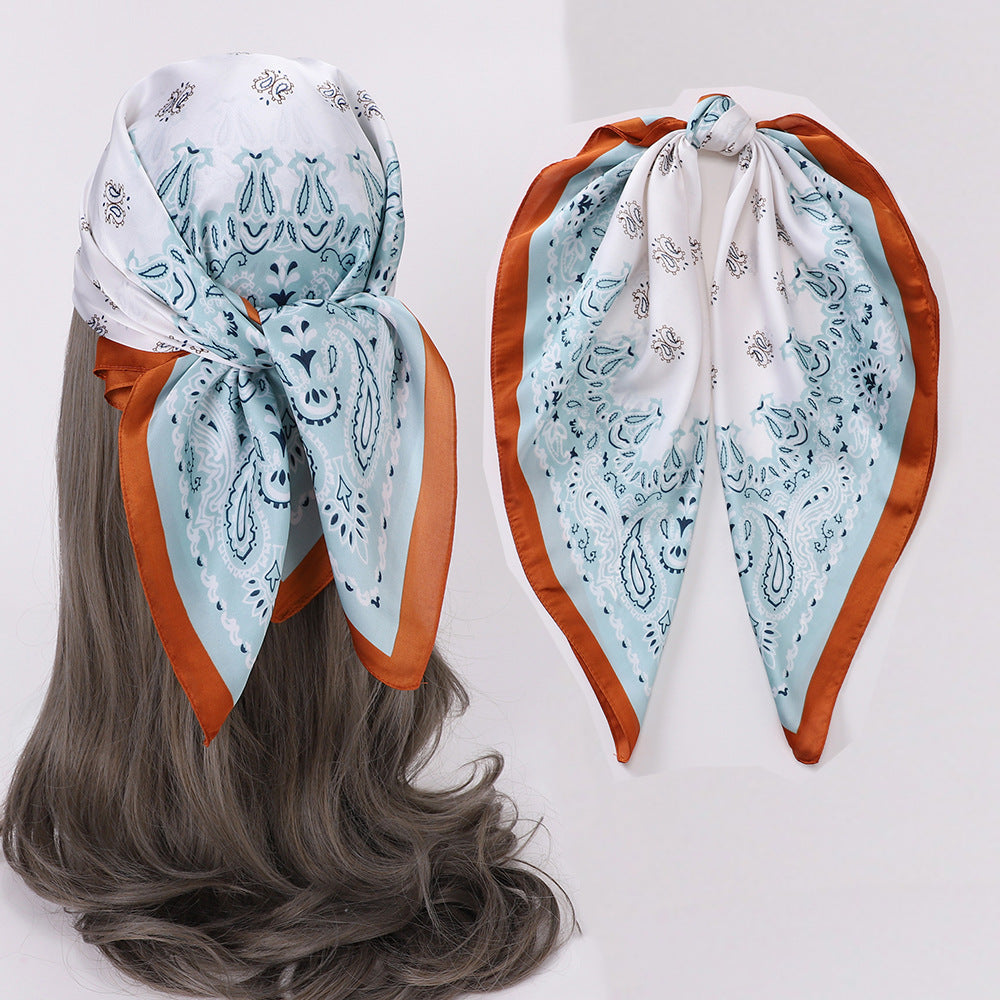 Scarvii Geometry Scarf Head Wrap styled as a headband with geometric print in earth tones