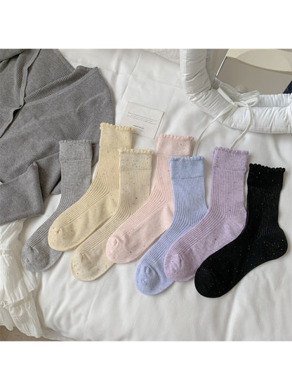 Model wearing Rufia rib crew socks with speckled knit texture and casual shoes